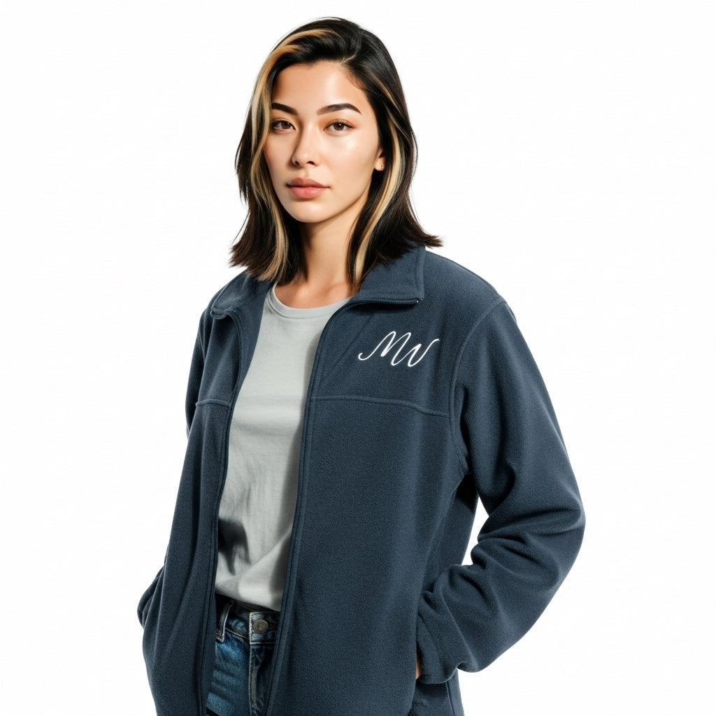 Woman wearing a navy blue jacket with a logo on a white background