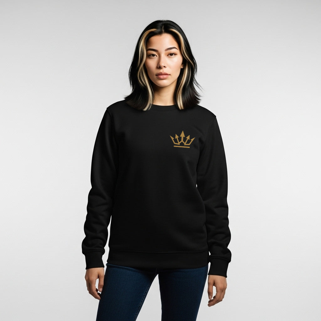 Person wearing a black sweatshirt with a gold crown logo on a light gray background